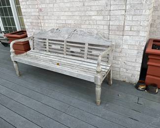 outdoor wood bench and large planters