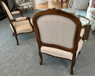 pair of off white upholstered wood arm chairs