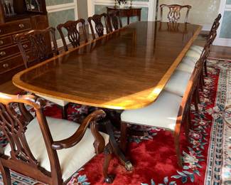 PRESALE AVAILABLE gather a large holiday crowd around this Baker Furniture Collector's Edition banded mahogany double pedestal table with 10 carved Baker chairs - table as shown with (3) 18" leaves is 124" L x 46"W