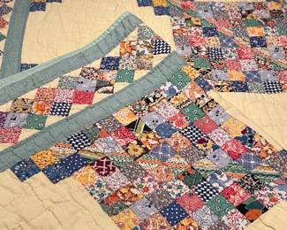 Handmade feedsack postage stamp quilt