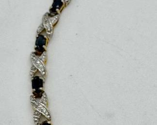 Sterling silver and dark blue sapphire bracelet.