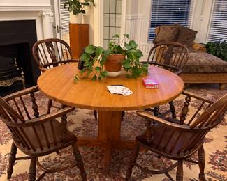 Round table with four Windsor chairs - a fifth chair is in the hallway