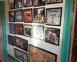 Hallway 
Framed record albums
John Lennon framed assassination paper