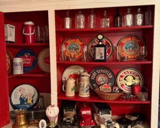 Dining Room 
Beer trays
Cars hold liquor bottles in them 
Utica club steins
Local yardsticks