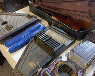 Antique stringed, keyboard and percussion instruments. 