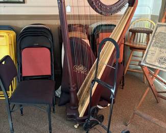 Beautiful Lyon and Healy full size harp with levers, case, chair, and dolly. 