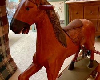 Antique wooden rocking horse.