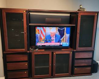 Entertainment center with screened speaker doors. GREAT PRICE ON THIS PIECE-BRING HELP TO REMOVE