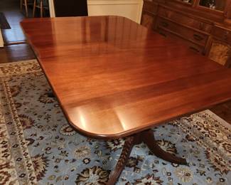 Double pedestal dining table by Lexington. Comes w 2 leaves & pads. Has some finish issues (pictured)