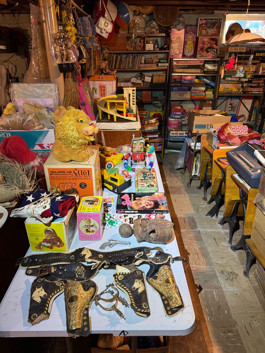 Basement. Down the stairs to the right in the kids and Avon area.