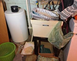 Basement. Down the stairs to the left.