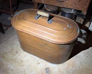 Basement. Down the stairs to the left.