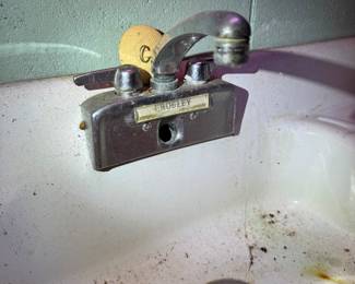 Basement. Down the stairs to the left.