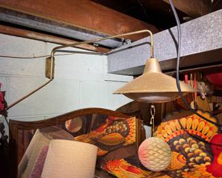 Basement. Down the stairs to the right. hanging on back wall