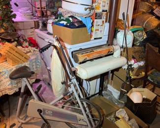 Basement. Down the stairs to the left.