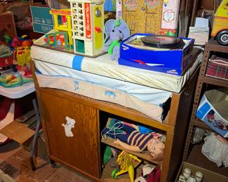 Basement. Down the stairs to the right in the kids and Avon area.