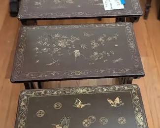 4 Brown Lacquer Chinoiserie Nesting Tables. 