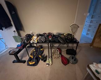 Lacrosse equipment, tennis rackets, weights and bench