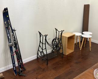 Old skis, vintage sewing machine base