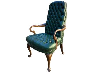 Green leather tufted executive armchair, possibly Hancock and Moore