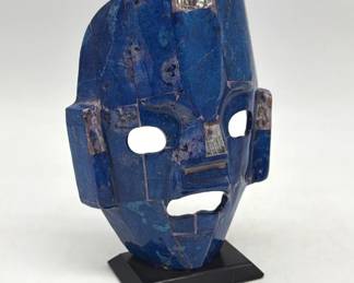 Stone like Aztec burial mask sculpture