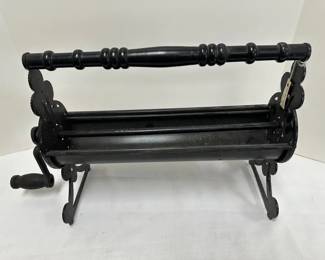 Vintage Cast Iron Newspaper Log Roller