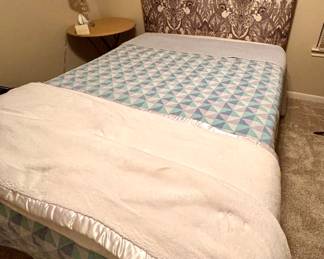 Upholstered Queen Headboard
Queen Size Bed
Round Folding Table
Small Lamp