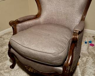Louis XV-style armchair with a carved wooden frame