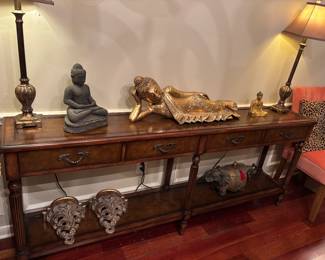 • Vintage Long Hallway Console Table
Gold Reclining Buddha 
• Matching Lamps
• Buddha in Seated Position
• Two ornate gold wall shelves with a Rococo or Hollywood Regency style
