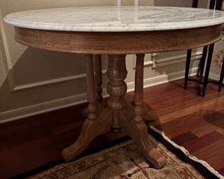 Classical Style Round Table with Marble Top and Wooden Pedestal base. 
42” Wide  x  31” Height
Large enough to be used as a Breakfast Table and Small enough for a Side Table