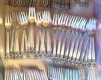 Sterling Silver Flatware 32 dinner knives
50 dessert and/coffee spoons
24
25 salad forks
14 dinner forks
23 bread knives
8 olive forks
12 sugar spoons