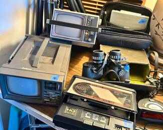 Small electric portable TVs; recorder, binoculars
Wood cassette tape holders & tape casseytes
Metal Drape screen poles