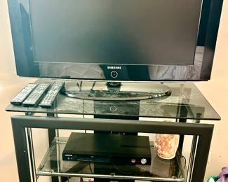 3 tier Glass shelf TV stand
Samsung TV with remote
Samsung DVD player with remote
