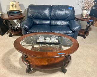 Oval dark wood glass top two tier coffee table
