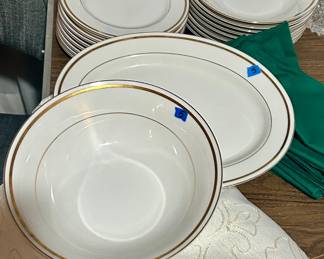 White China with gold trim, and service pieces