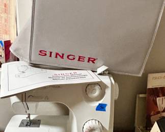 Singer table top sewing machine with cover $50