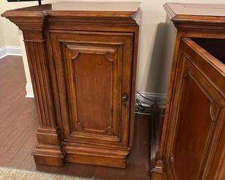 C111 - $1750. Sligh TV Lift Media Cabinet with Remote. Moves in 3 pieces. Each side piece is 24" wide x 27" deep x 34" tall. Center piece is 5' long x 28" deep x 34" tall. 