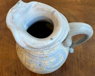 C40 - $25. Heavy Pottery Pitcher. Measures 10.25" tall. 