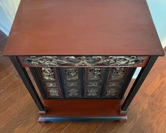 C49 - $150. Small 4 door Asian Cabinet. Lacquered Finish black & red. Measures 21" wide x 12.75" deep x 27.5" tall. 
