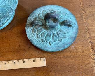 C123 - $250. Bronze Ware lidded vessel. Measures 11" wide x 16" tall. Does have pitting and a few tiny holes. 