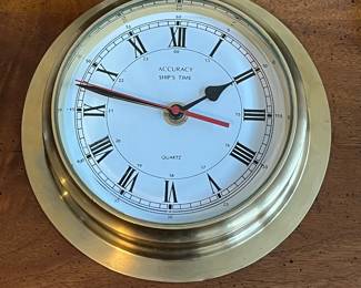 C81 - $25. Brass Accuracy Clock. Ship's Time. Measures 8.5" across. Battery Powered. 