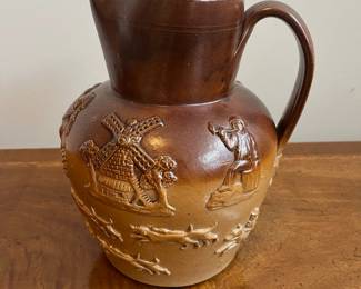 C79 - $40. 19th Century Royal Doulton Lambeth Pitcher. Salt Glazed. Measures 8.5" tall. 1 very minor chip on the top rim. 