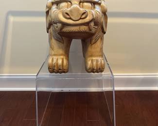 C42 - $450. Foo Dog Side Table. Glass top with lucite bases. Measures 66" x 15" deep x 28.5" tall. Dogs are porcelain material. 