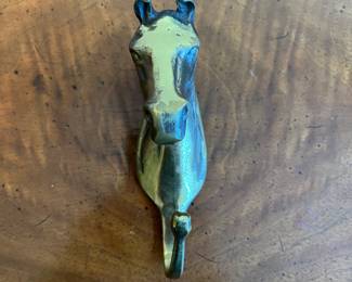 C47 - $18. Brass Horse Hanger. Measures 6" long x 3.25" deep. 