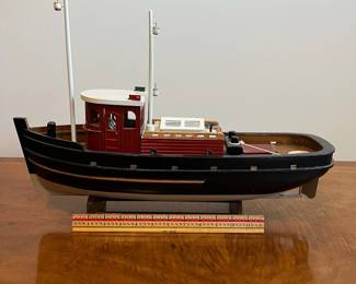 C25 - $30. Decorative Wooden Boat. Measures 20" long x 6" wide x 15" tall. 