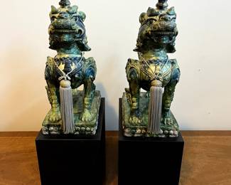 C99 - $350. PAIR of Foo Dogs on Hollow Wooden Stands. Measures 11" x 6" x 19" tall. One "knob/horn" has been repaired. Beautiful colors!