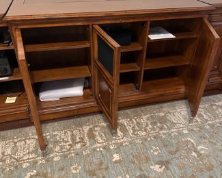 C111 - $1750. Sligh TV Lift Media Cabinet with Remote. Moves in 3 pieces. Each side piece is 24" wide x 27" deep x 34" tall. Center piece is 5' long x 28" deep x 34" tall. 