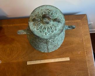 C123 - $250. Bronze Ware lidded vessel. Measures 11" wide x 16" tall. Does have pitting and a few tiny holes. 