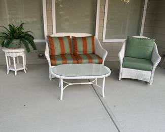 C107 - $500. 4 Pc. Wicker Porch Furniture. Metal frames with wicker over. Used on covered porch. 