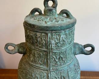 C123 - $250. Bronze Ware lidded vessel. Measures 11" wide x 16" tall. Does have pitting and a few tiny holes. 